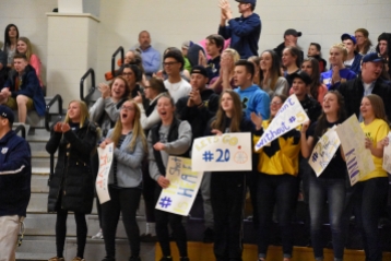 The Chelsea student section react to a big play