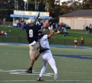 Hunter Neff leaps over a Pirate for a catch